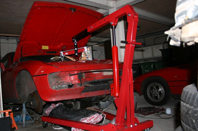 Porsche 924 S 2.5l Engine being lowered on a hoist